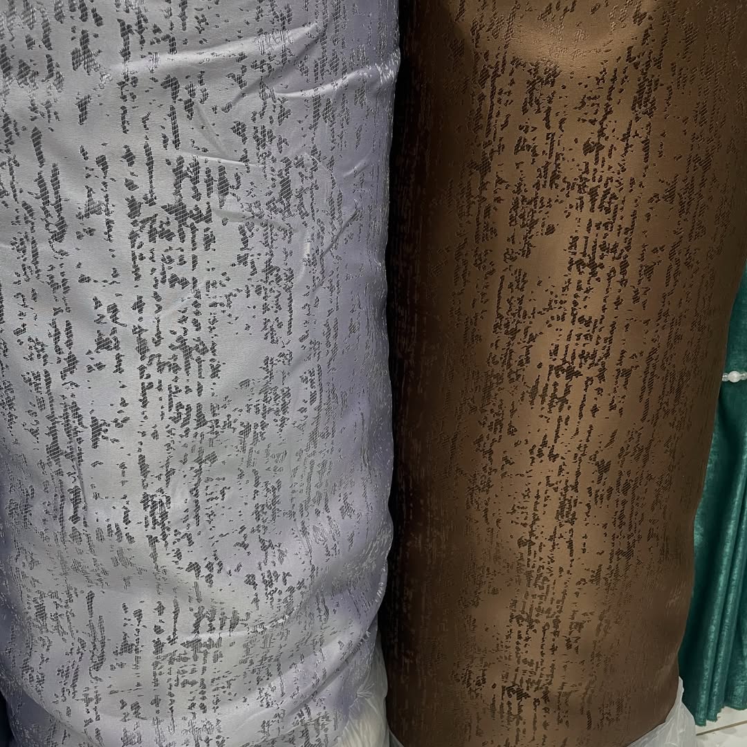 Display of 2026 curtain fabric designs in various textures and colors at Deco Dreams Curtains showroom in Nairobi.
